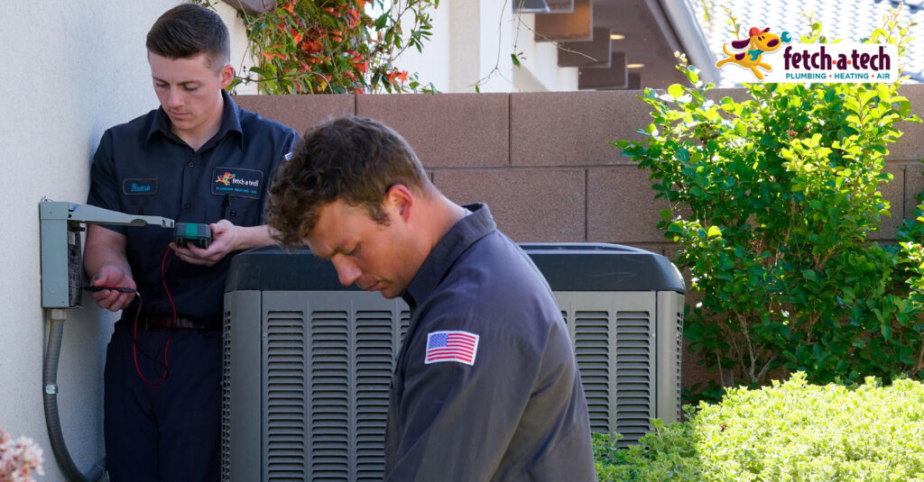 Fetch-A-Tech technicians working on air conditioner